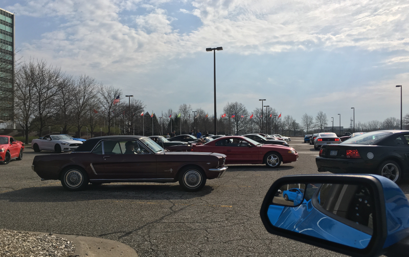 Lookit all these generations of Mustangs together.
